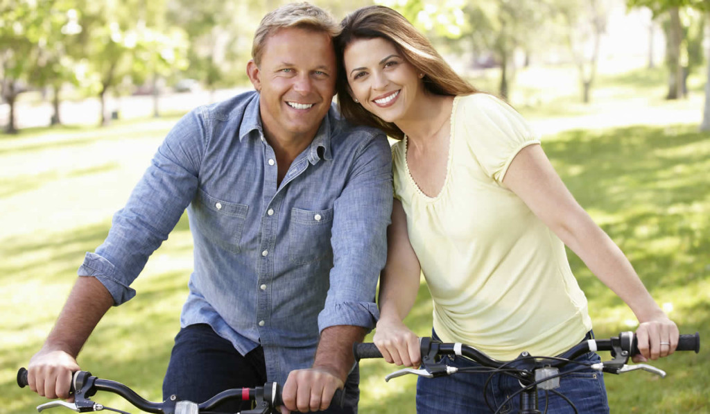 Couple enjoying a summer day on their bikes, London City Mortgages