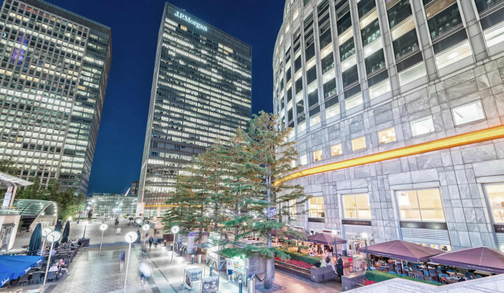 Modern buildings bars and restaurants at night Canary Wharf, London City Mortgages