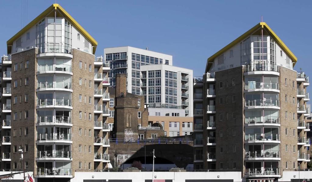 Riverside flats and boats in Limehouse Basin, London City Mortgages