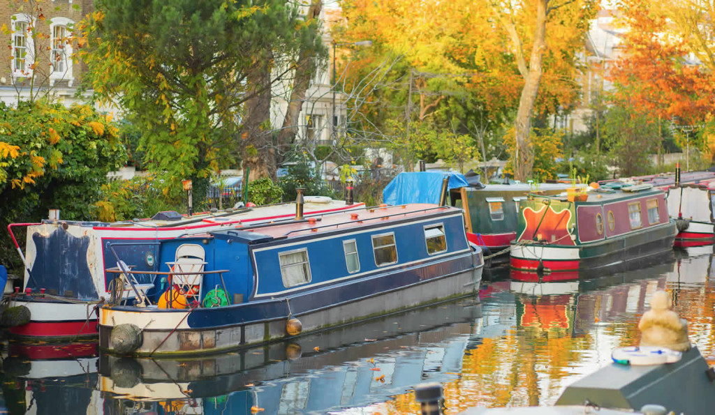 Rows of canal houseboats in Little Venice Paddington, London City Mortgages