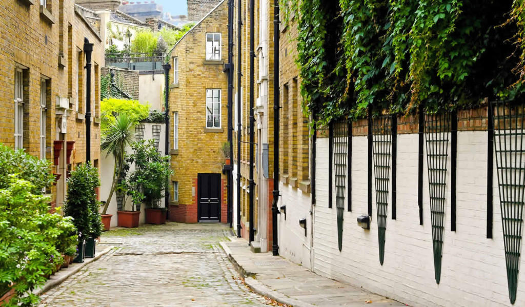 Terraced houses on narrow cobbled street, South London City Mortgages