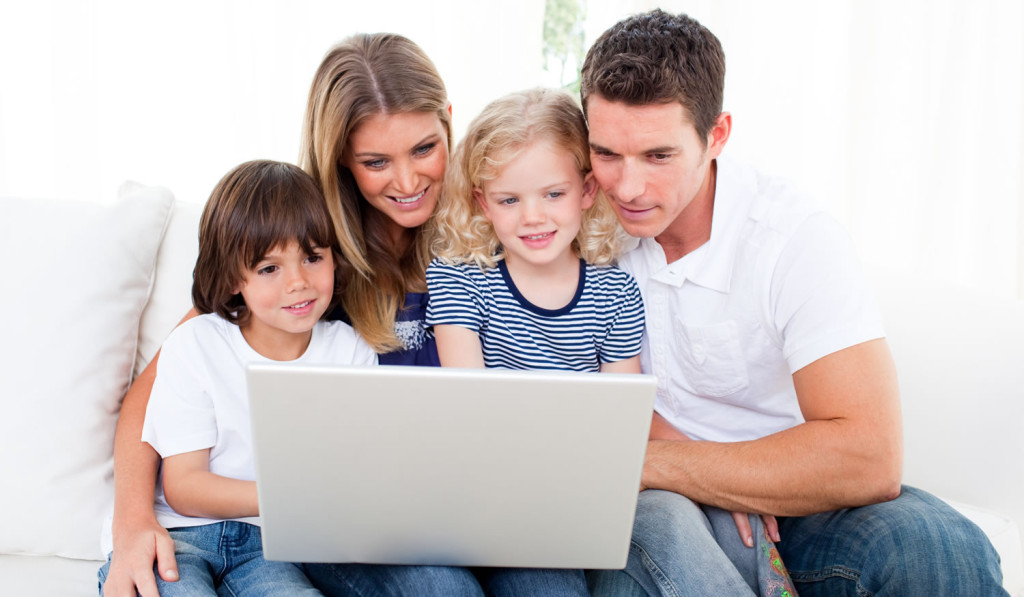 Comfortable home with family using laptop London City Mortgage