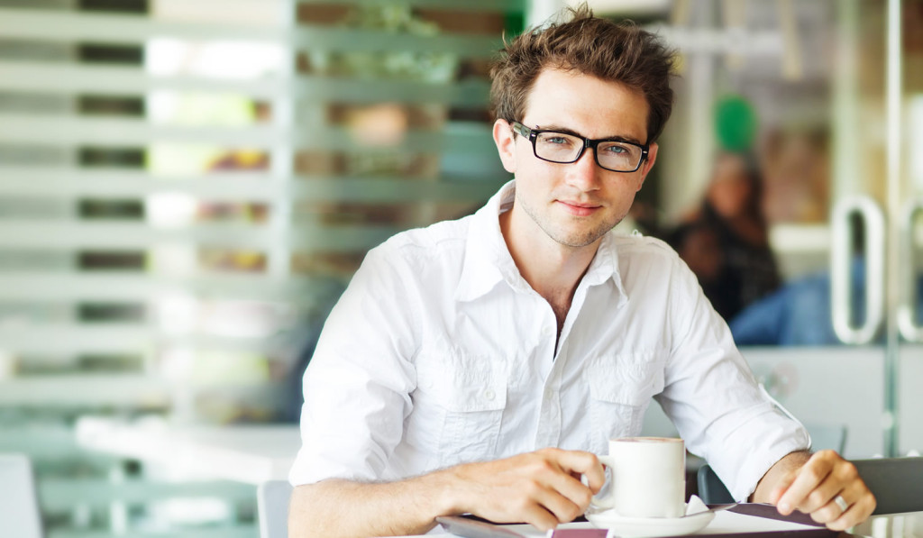 Confident young buyer drinking coffee London City Mortgages