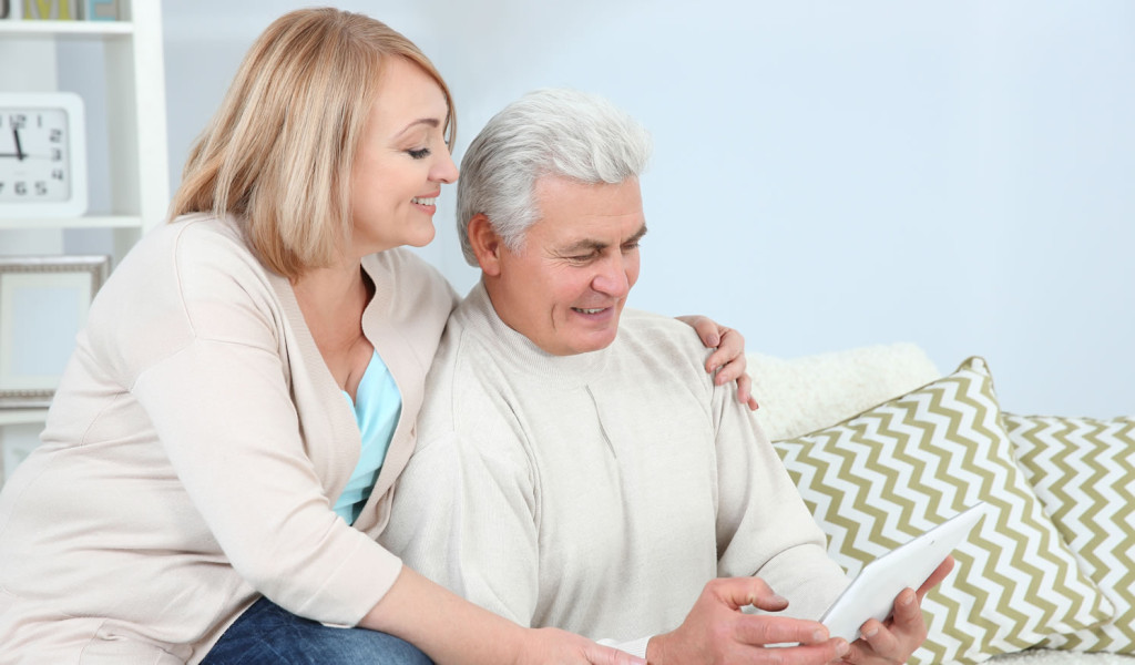 Livingroom with retired coupe on tablet London City Mortgages
