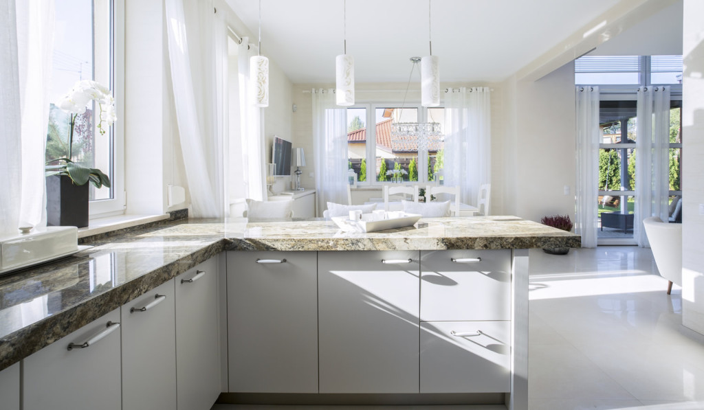Open plan luxury white kitchen livingroom London City Mortgages
