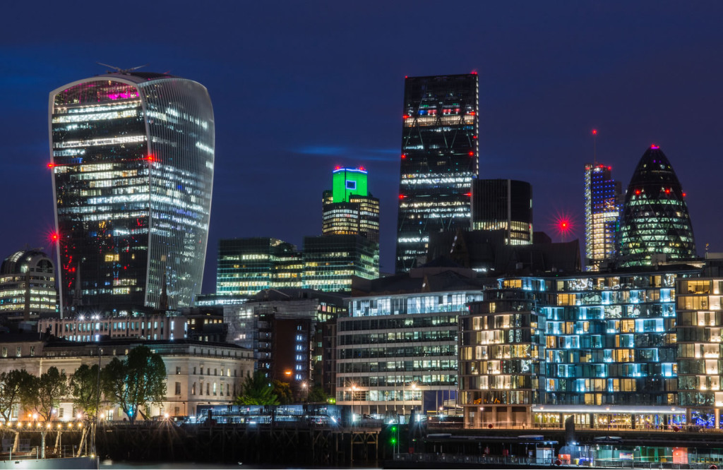 Futureistic night view skyscrapers and apartments London City Mortgages