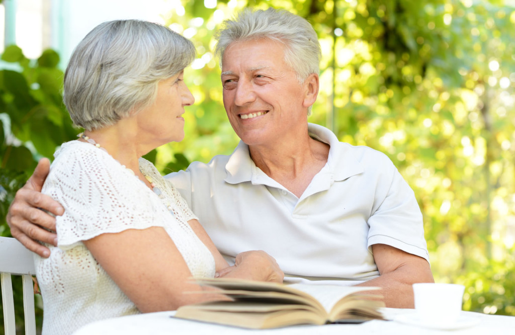 Older couple outdoors enjoying the sun London City Mortgages